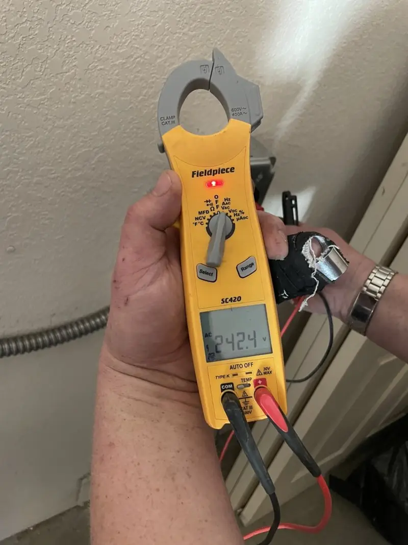 Voltage testing with clamp meter during Generator Installation in Mount Washington